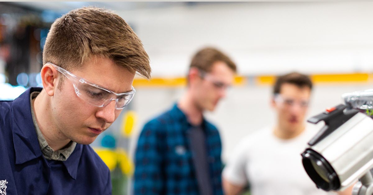 Workers wearing safety glasses to protect their eyes