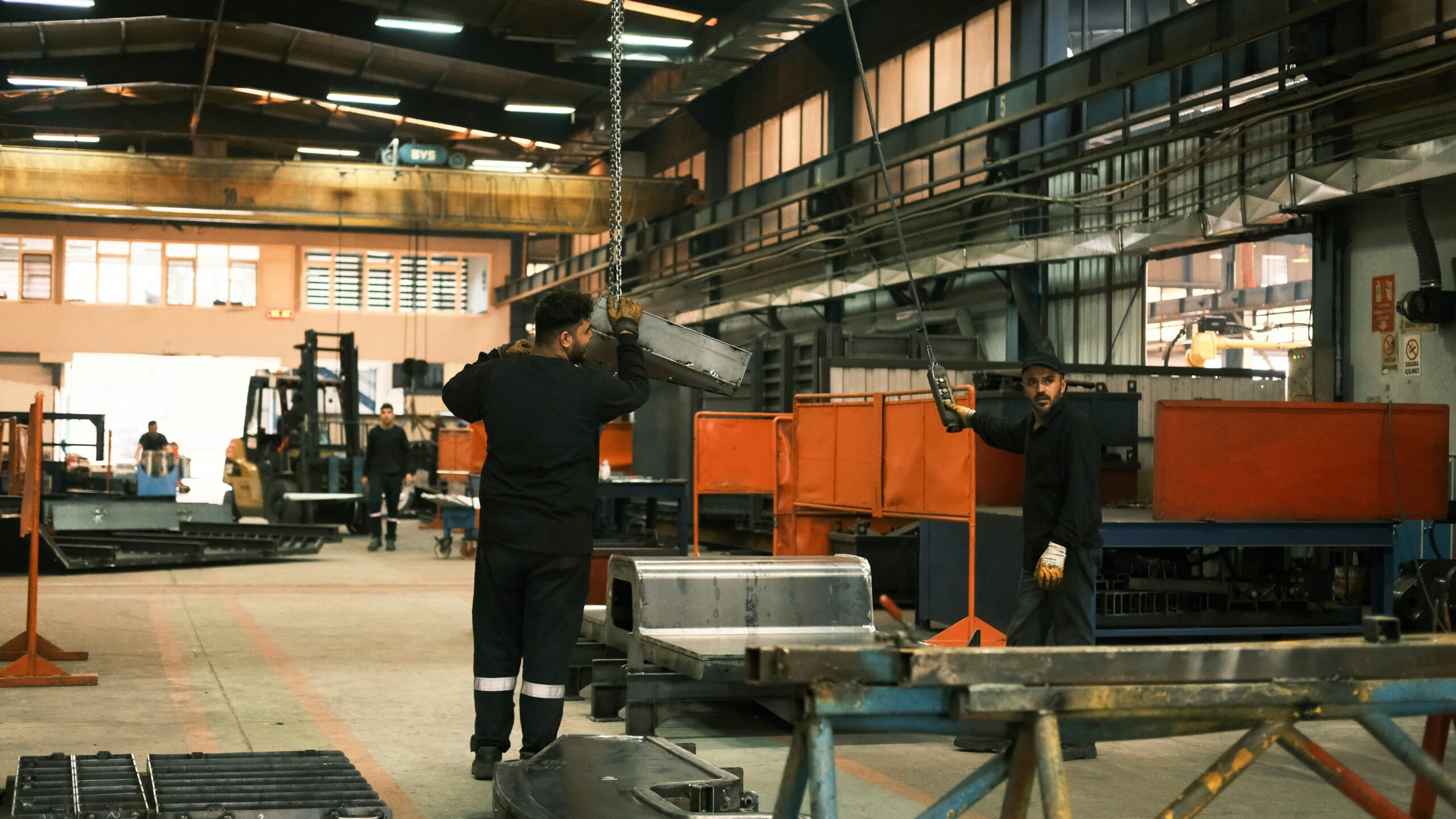 Interior view of a well-maintained industrial facility with safety signage and clear walkways