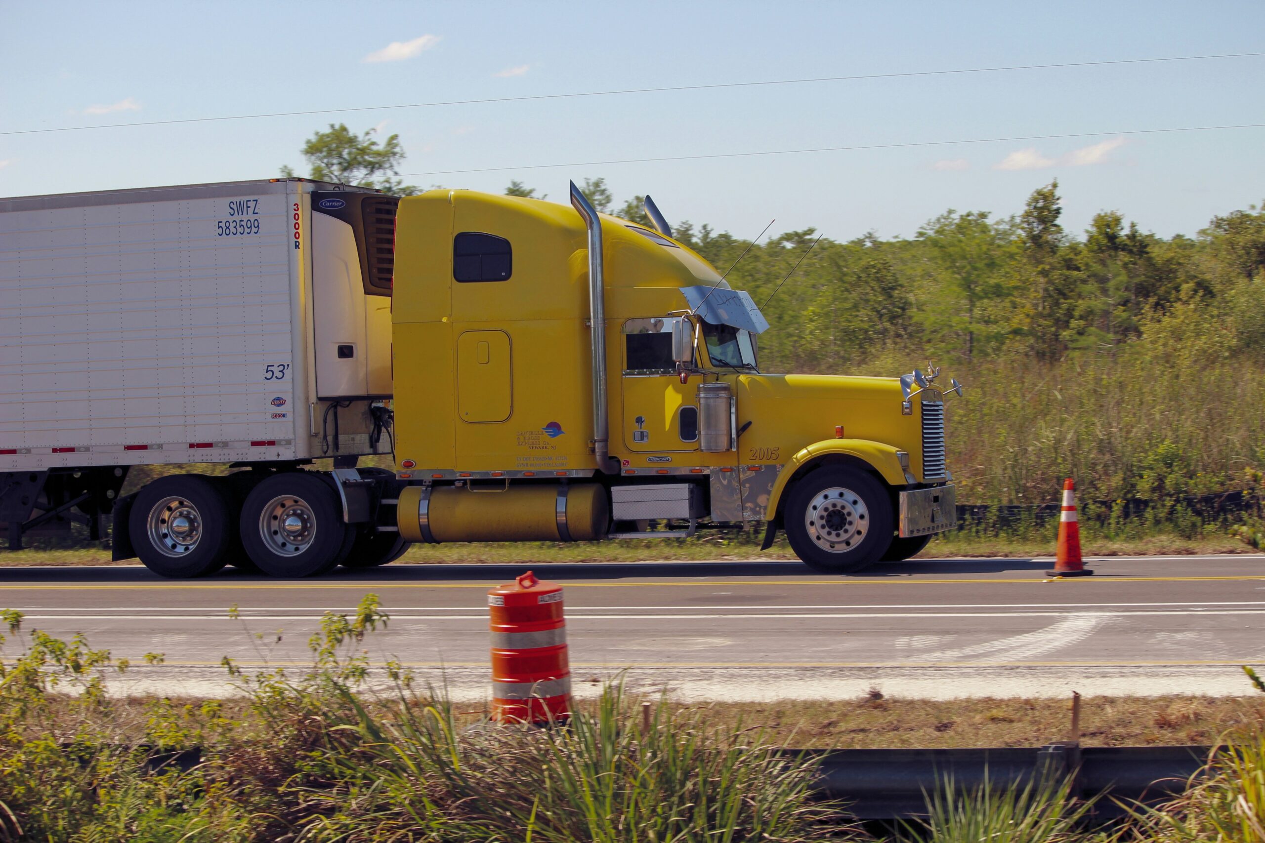 Commercial truck driver following transportation safety guidelines on a highway