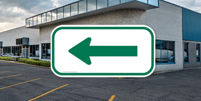 Green and White Reflective Arrow Sign