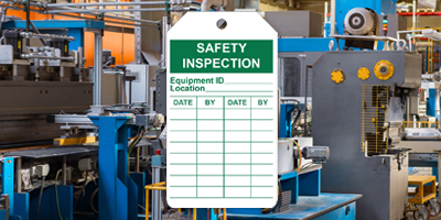 Green and white inspection tag to track safety checks