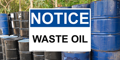 OSHA Notice Waste Oil Sign and Oil Drums
